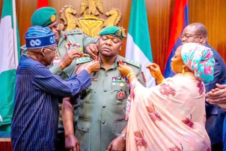 President-Bola-Ahmed-Tinubu-left-assisted-by-others-decorating-his-ADC-Nurudeen-Yusuf-with-rank-of-Colonel-at-the-Presidential-Villa-Abuja-in-January-2025 (1)
